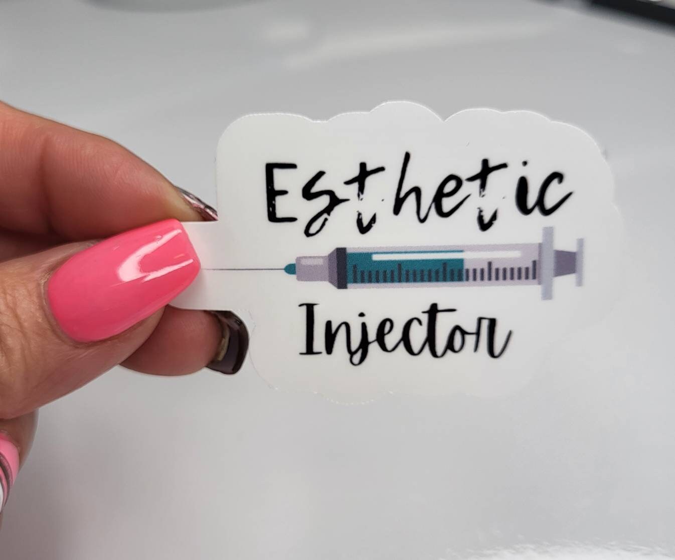 Esthetic injector sticker